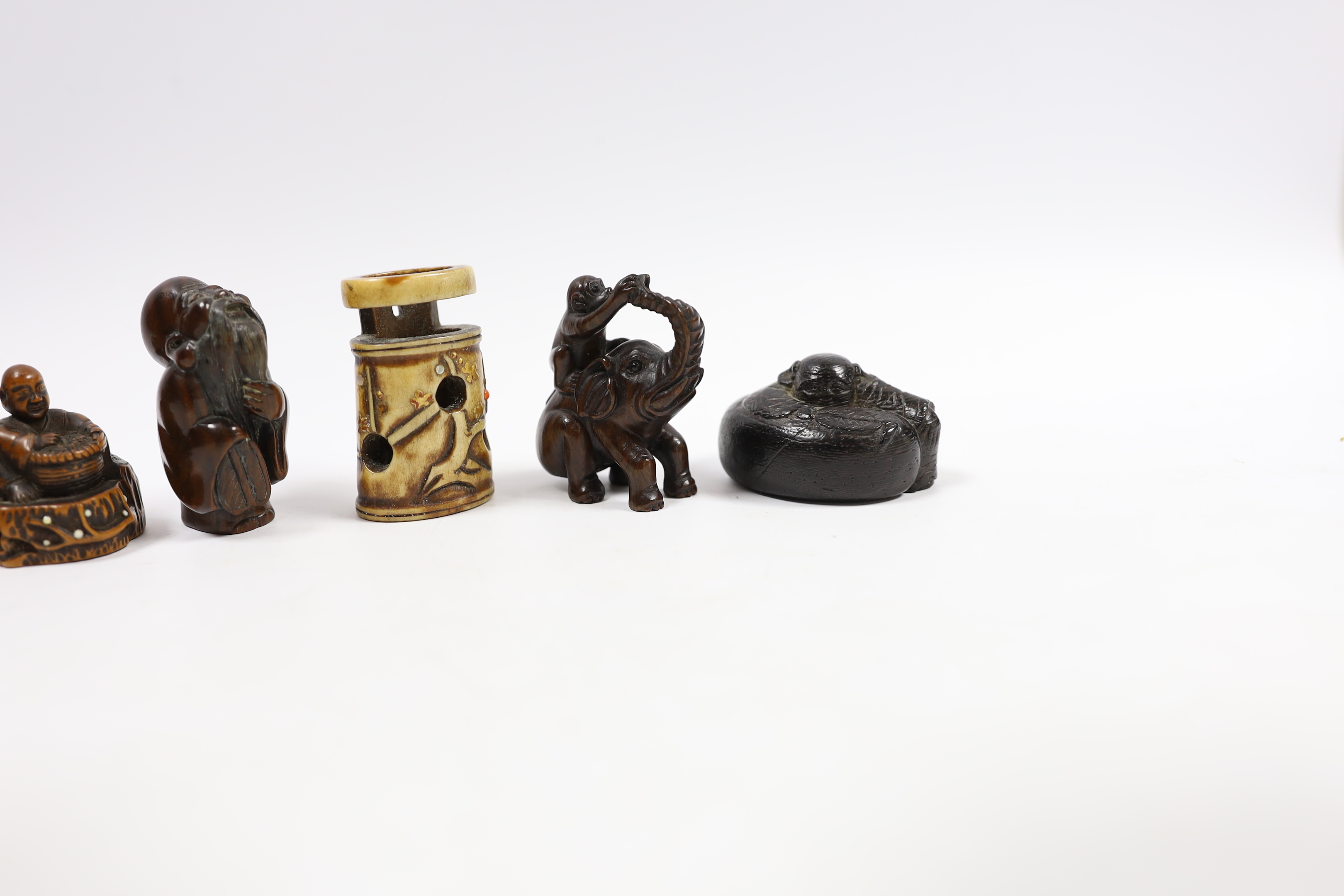 A group of six Japanese netsuke in wood, staghorn and lacquer, 19th century and later